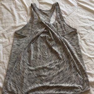 Loose fit and comfy lulu tank with back detail!